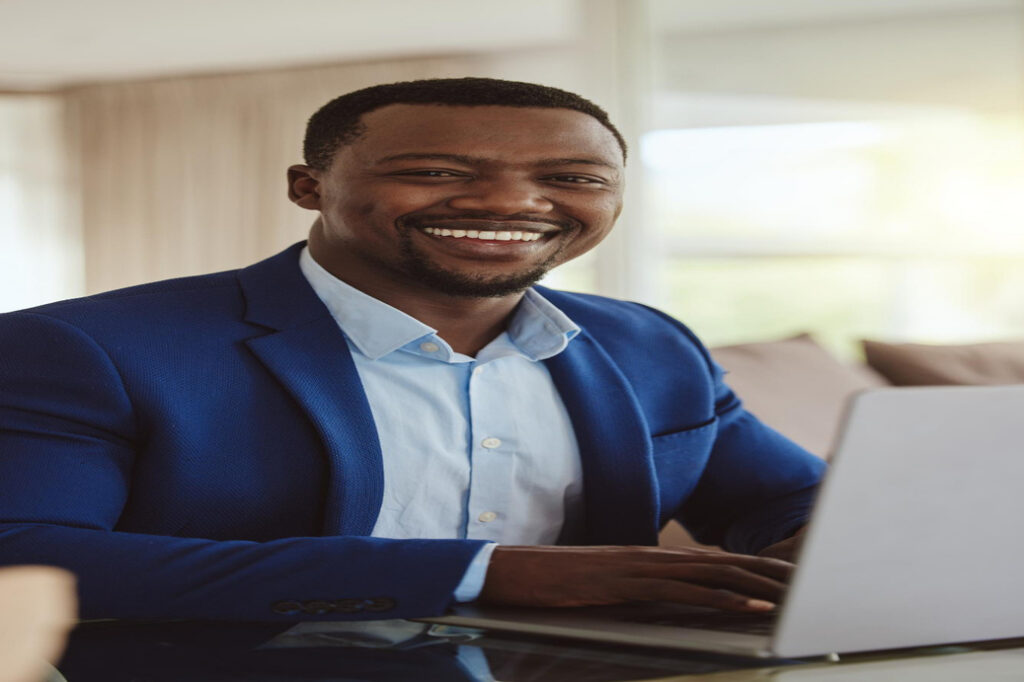 happy-business-portrait-black-man-with-laptop-planning-connection-email-work-wifi-smile-corporate-research-executive-african-businessman-typing-proposal-computer